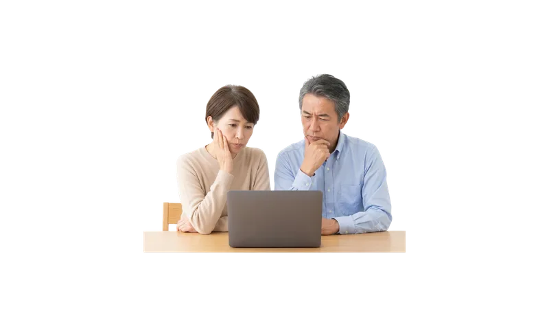 不用品の処分について相談する夫婦(イメージ)